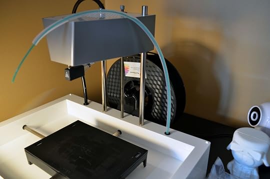 The filament is now loaded. Note that in order to better keep smaller 0.5 kg spools on the New Matter MOD-t in place, I printed and now use the Half Kilo Spool Converter, which is that brown bit on the black spool. You can find it in the New Matter store and it works brilliantly.