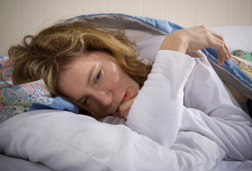 1008-10-chronic-fatigue-syndrome-s1-woman-suffers-from-cfs-in-bed