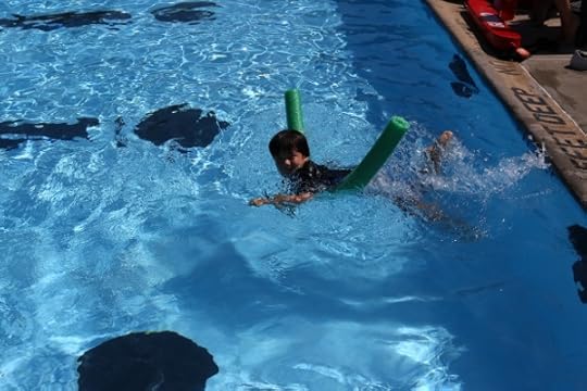 The Pip swimming with a noodle at the Niskayuna town pool.
