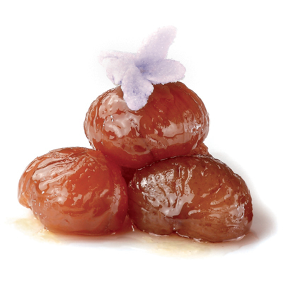 Lush castañas glaseadas topped with what looks like a violeta glaseada. 