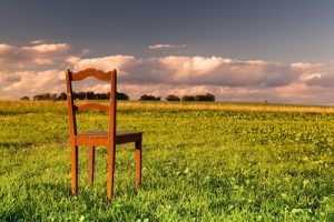 The restless chair on the empty field at sunset