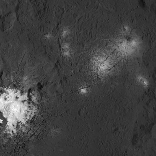 Inside Occator Crater, showing the bright pattern of salts (mostly sodium carbonate), NASA/JPL
