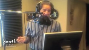 Tom Shane recording a radio spot to de-position his competition.
