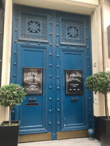 When space is an issue, pretty flowering shrubs in pots outside stately doors made vibrant with blue are about as beautiful a garden as you need!