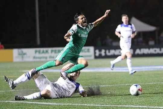FCE defender Albert Watson got a yellow card for this challenge on New York's Andres Flores. PHOTO: NEW YORK COSMOS