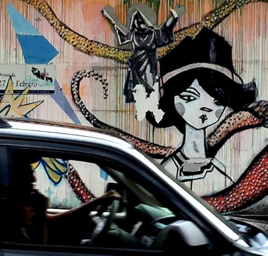 Car passes street art