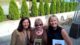 Kelle Grace Gaddis, Natasha K. Moni, and me (holding books!)