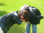 Juanita gets cosy with a calf.