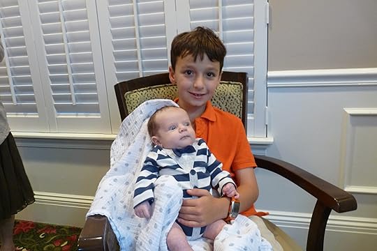 Oldest great-grandson (my sister, Judy's, grandson) with Caleb, my new great-grandson. Jacob was a natural!