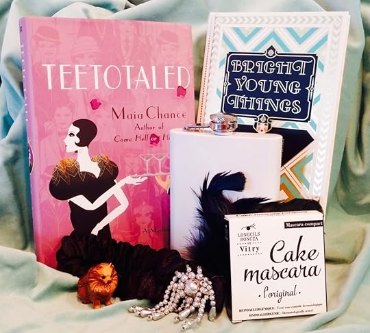 This prize pack is the bee's knees. Enter to win an autographed copy of TEETOTALED, a copy of the wonderful BRIGHT YOUNG THINGS: A MODERN GUIDE TO THE ROARING 20s, Longcils Brncza cake mascara, a vintage porcelain Pomeranian, a flask, and a blingy feathered flapper headdress!