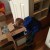 Unpacking in his new bedroom