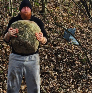 phil bennett of completemmatraining.com lifting a stone