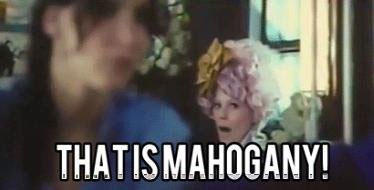 Effie Trinket in The Hunger Games, with the text 