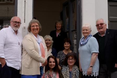 Group shot of authors in doorway of bookshop