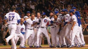 CHICAGO, IL - JULY 27: Members of the Chicago Cubs wait to welcome Kris Bryant #17 after he hit a game-winning, two-run home run in the bottom of the 9th inning against the Colorado Rockies at Wrigley Field on July 27, 2015 in Chicago, Illinois. The Cubs defeated the Rockies 9-8. (Photo by Jonathan Daniel/Getty Images)