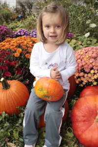 chloe-sitting-on-our-pumpkins