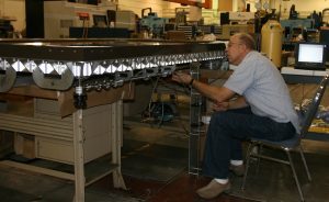 Physicist Charles Tilford attaches an apparatus that replaces air in the encasement with inert argon gas to help preserve the 1507 Waldemüller map. Photo courtesy of the National Institute of Standards and Technology.