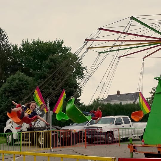 William and Adelaide on the swings at the county fair