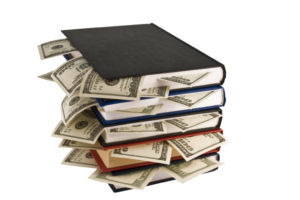 Dollars in the books, isolated on white background, business training.