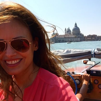 In the water taxi on my way into the city. even the taxi rides are chic in Venice!