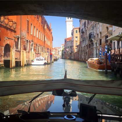 In what other city do you get to buzz around on retro wooden boats, on water canals, feeling like James Bond?