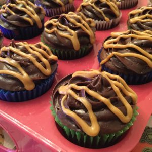 choc-cupcake w cookdough filling topped with choc frosting and sea salt caramel drizzle