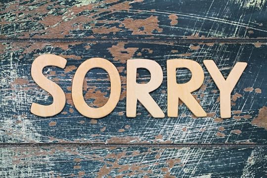 40257189 - sorry written with wooden letters on rustic blue surface