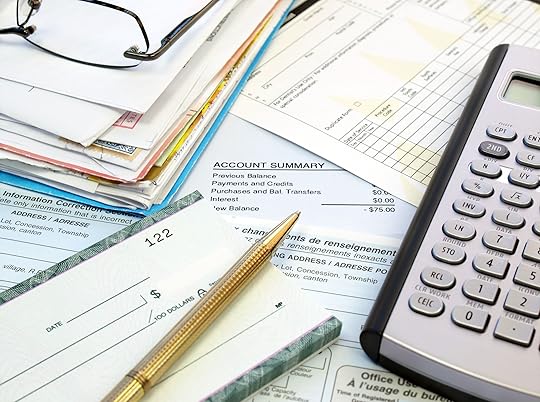 10213700 - a pile of bills, checkbook, pen and calculator on the table.