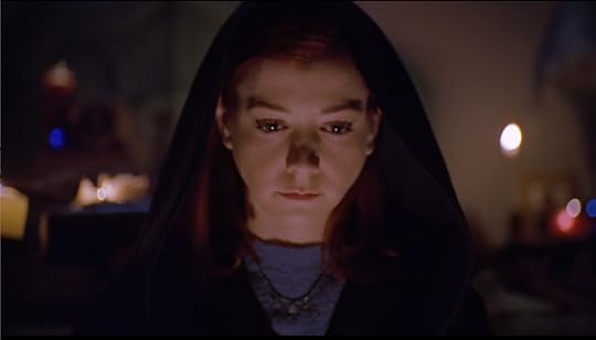 Willow, wearing black robes and looking very intently at the ritual going on.