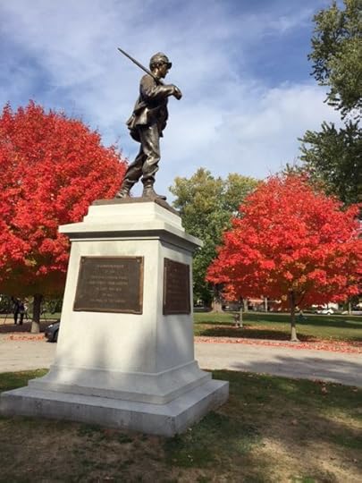 Red maples flank a solider at Riverbank Park on Main Street in Westbrook
