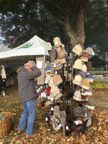 trying on hats at Sankow's Beaver Brook Farm