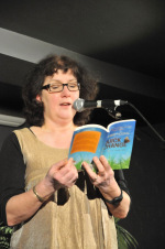 Picture of Debbie reading from Quick Change