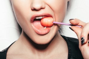 Licking a lollipop