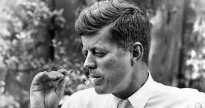 president-kennedy-smokes-a-cigarrillo-outside-photographer-howell-conants-nyc-studio