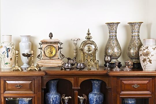 19014571 - various antique clocks vases and candlesticks on display