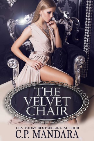 sexy blond in beige silk dress sitting on the black armchair