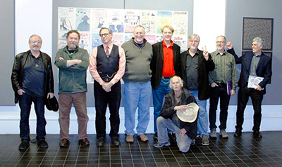  Posing in front of the wall of Scribe covers: Monte Wolverton, Patrick Rosenkranz, me, Maurice Isserman, Bill Plympton, Matt Groening, Richard Gehr, Norman Solomon, (front) Walt Curtis.