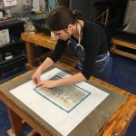 Ioana helps with placement and cleanup of the text block. This was a one-chance-only moment, once placed on the wet medium it cannot be moved or changed.