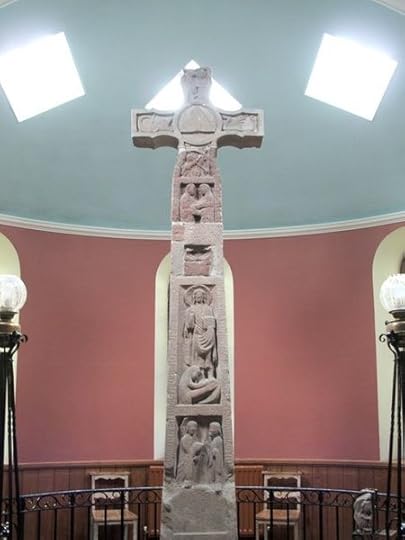 This is the famous Ruthwell Cross erected in England some twelve centuries ago. The word curse has nothing to do with cross