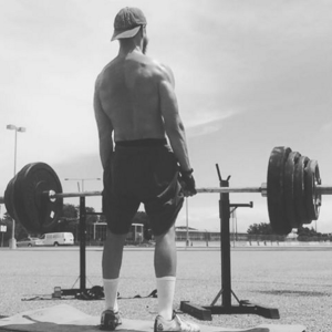 truck driver deadlifting at truck stop