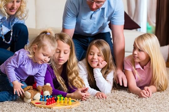 15785048 - family playing board game ludo at home on the floor