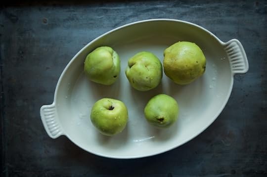 five quince in a baking pan for roasted quince butter
