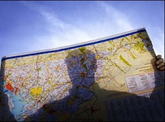 man-reading-map-300x215