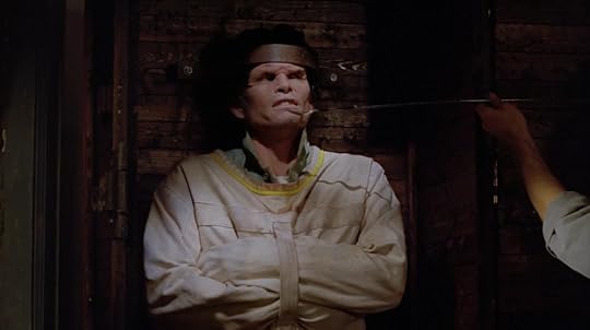 This vampire is trussed up in a straight jacket and bolted into the box with this thick metal bands. He looks not happy about it.