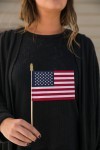 Woman holding U.S. flag.