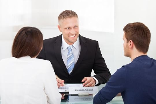 28161927 - rear view of young couple consulting financial advisor at office desk