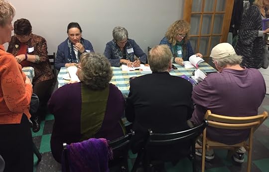 Several Beach Nights authors furiously signing books for loyal readers.