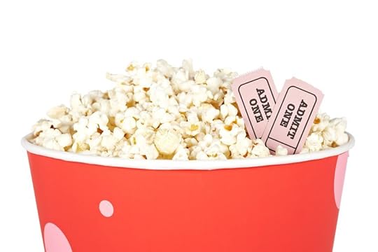 9003347 - detail of popcorn in a bucket and two tickets over a white background. tickets on focus and shallow depth of field