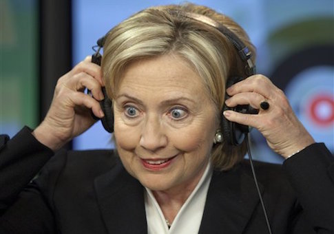 U.S. Secretary of State Hillary Rodham Clinton ajusts headphones at Echo Moskvy radio station Wednesday morning, Oct. 14, 2009. Clinton is wrapping up a five-day tour of Europe on Wednesday with a series of informal meetings in Moscow and the Russian republic of Tatarstan aimed at helping redefine U.S.-Russian relations. (AP Photo/ Alexander Zemlianichenko)