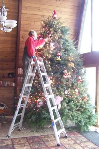 Pop, with the infamous 16-foot Christmas tree